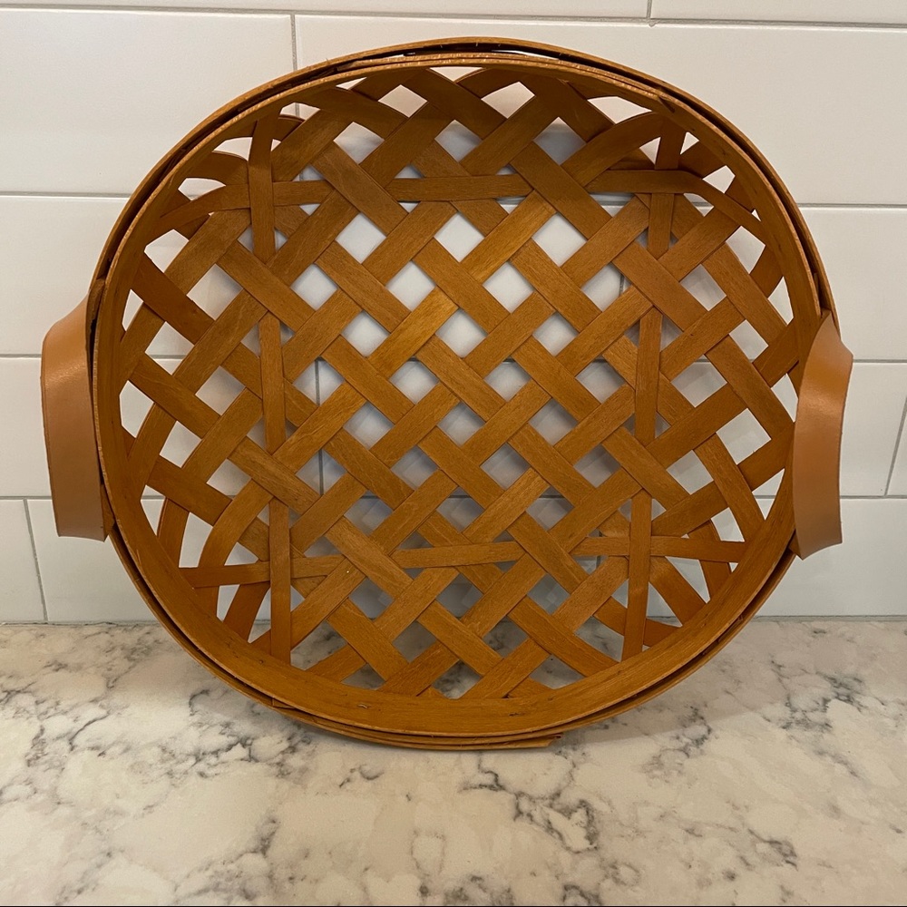 Henn 2003 open weave basket with leather handles